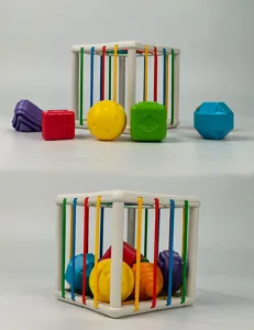 Baby shape sorter toy with colorful elastic bands and sensory blocks for early learning.