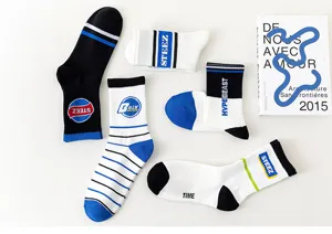 Stylish mid-calf cotton socks with trendy letter prints, streetwear casual comfort for men.
