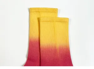 Detail shot of colorful gradient tie-dye cotton mid-tube socks for women and couples.
