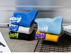 Detailed shot of trendy letter printed cotton socks in multi colors for men summer daily wear.