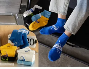 Detailed shot of men's summer short socks featuring trendy letter prints and breathable cotton fabric.
