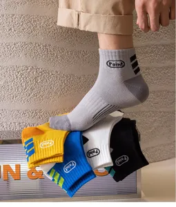 Detail shot of stylish men short cotton socks with letter print and sport stripes for daily wear.