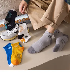 Detail view of men's short cotton socks with letter prints, breathable and stylish for spring.