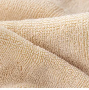 Thermal loop sock fabric close-up, thick winter cotton terry material texture detail.
