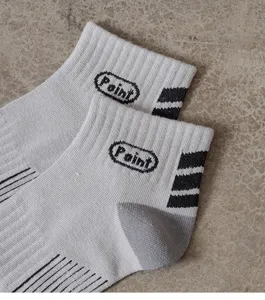Detail view of men's spring summer short cotton socks with stylish black stripes and letter print.