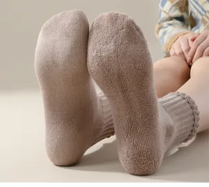 Thickened terry winter socks for women and men, cozy thermal loop knit crew socks in beige.