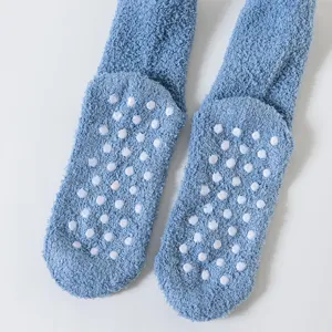 Thickened coral fleece anti-slip floor socks with dotted soles for cozy autumn and winter home wear.