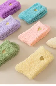 Cozy coral fleece fuzzy socks for women, thick warm winter sleeping floor socks with cute gold heart.