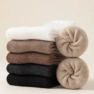 Thick winter thermal mid-tube socks stack display, cozy fleece lined design, cozy warmth.