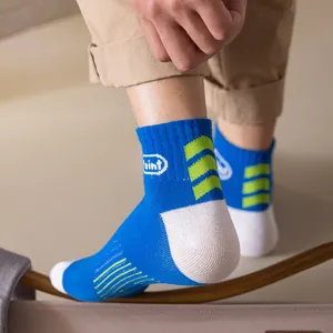 Men's blue short athletic cotton socks featuring green stripe details and ankle fit style.