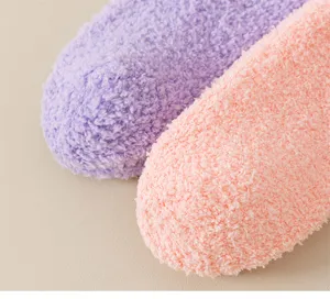 Detailed close-up view showing soft plush coral fleece winter warm socks texture.