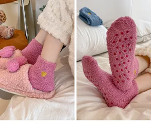 Cozy coral fleece women's floor socks with cute heart embroidery and anti-slip grip sole details.