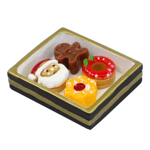 Detailed miniature Christmas resin food set with gingerbread man and Santa Claus desserts