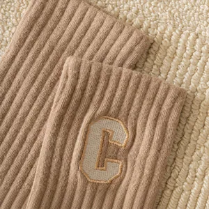 Cozy winter cotton mid-tube socks featuring a stylish C letter embroidery and ribbed cuffs.