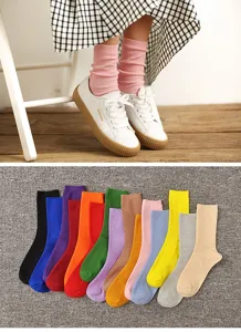 Detailed view of colorful stackable cotton mid-tube socks, soft fabric and comfortable fit.