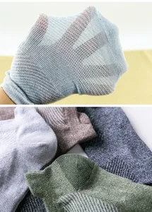 Close-up view of breathable mesh sock fabric, showing lightweight and elastic summer material.