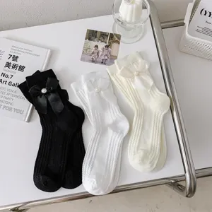 Chaussettes mi-mollet Lolita nœud papignon pour femmes, design côtelé, parfait pour le quotidien.