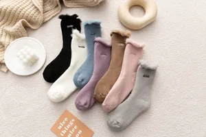 Cozy winter fleece-lined women socks with sweet embroidery cuffs and warm thermal design for home.