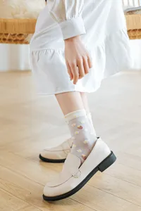 Cute Japanese white sheer socks with sweet strawberry and daisy flower prints for women.