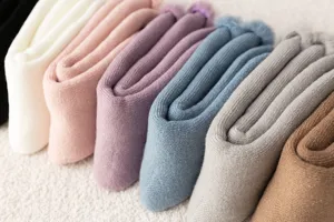Thickened thermal winter socks, cozy rolled edge fleece mid-tube towel socks for women detail.