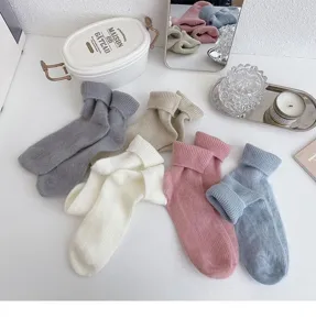 Cozy plush mid-calf socks for women, thick warm winter fleece solid color slouch socks detail.