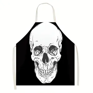 Detailed view of the Halloween skull apron, featuring a striking black and white design.