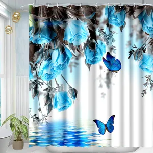 Detailed view of the shower curtain featuring blue roses and butterfly watercolor design in bathroom.
