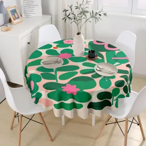 Mantel redondo impermeable con diseño de ilustración minimalista de hojas verdes y flores rosas.