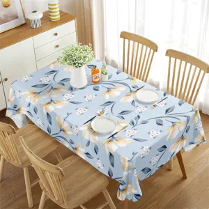 Detailed shot of a rectangular waterproof tablecloth with blue floral pattern for dining decor.