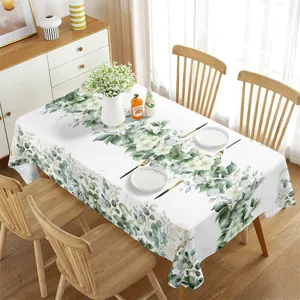 Waterproof rectangular tablecloth with fresh green leaf pattern for summer dining table decor.