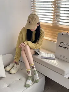 Cute cartoon student mid-tube socks with cute bear and grid pattern for daily fashion wear.