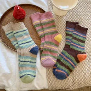 Cozy fuzzy striped mid-tube socks for women, thick warm winter retro color-blocked design.