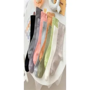 Detailed view of women's candy color mid-tube cotton socks, soft and trendy everyday wear.