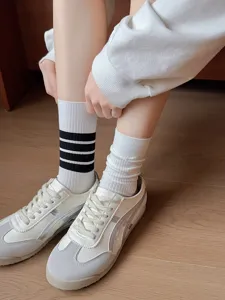 Detail view of women's thin mid-calf socks with striped design, Japanese JK college style.