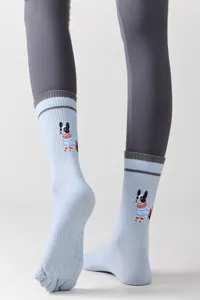 Detailed view of light blue toe socks featuring cute dog graphic and silicone non-slip grip sole.