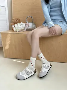 Cute women's mid-tube socks featuring adorable embroidered letters, cozy and stylish for daily wear.