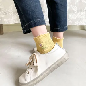 Cute yellow lettuce trim floral embroidered crew socks for women casual daily wear.