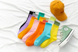 Colorful mid-tube socks detail shot showcasing vibrant candy colors and soft fabric texture.
