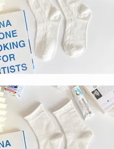 White Japanese style cotton socks detail view, featuring delicate diamond and ribbed knit patterns.