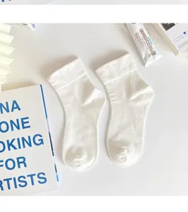 Detailed view of white mid-tube socks, Japanese ins style, soft and breathable summer wear.