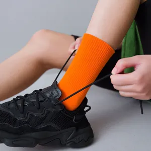 Vibrant orange ribbed mid tube socks for women, trendy Japanese style spring candy socks.