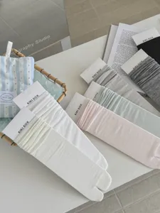 Detailed view of solid color split-toe cotton socks, breathable spring summer thin socks.
