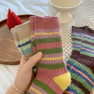 Cozy fuzzy striped mid-tube women socks, soft plush knit material, vintage sweet autumn winter style.