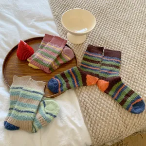 Cozy fuzzy striped mid-tube socks for women, thick warm winter retro color block design.
