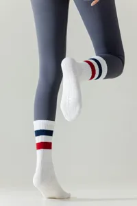 White non-slip yoga socks for women, athletic grip socks for pilates and fitness.