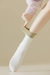 Detail shot of contrast double ribbed fake two-piece sports socks, showing cuff and texture.