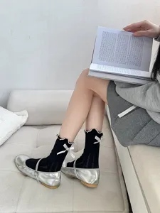 Sweet Lolita black ruffled socks with cute white bows for women, stylish daily aesthetic wear.