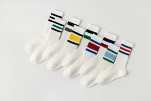 White yoga socks for women, breathable sports long socks with colorful stripes, anti-slip grip.
