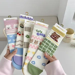 Cute women's mid-tube socks with sweet cartoon patterns, breathable mesh design for summer.