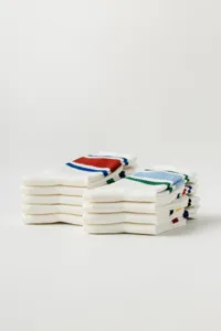 Detailed view of folded white athletic socks with colorful stripes, perfect for yoga and fitness.